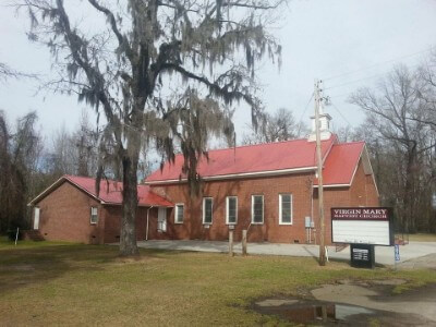 Brick-walled church with a cinnamon rib roof